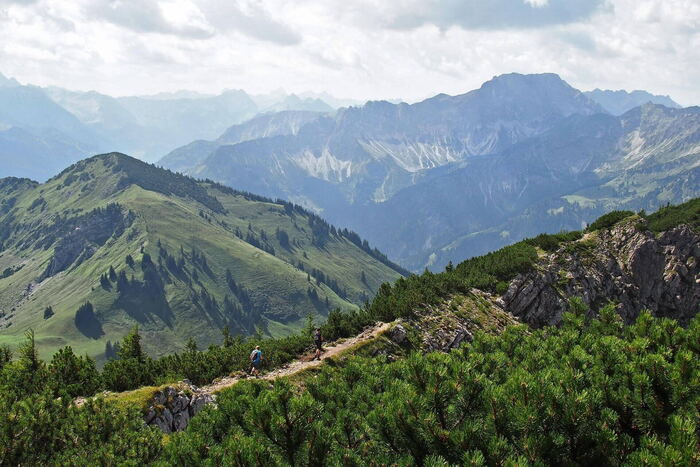 Marked hiking trail through a mountain landscape