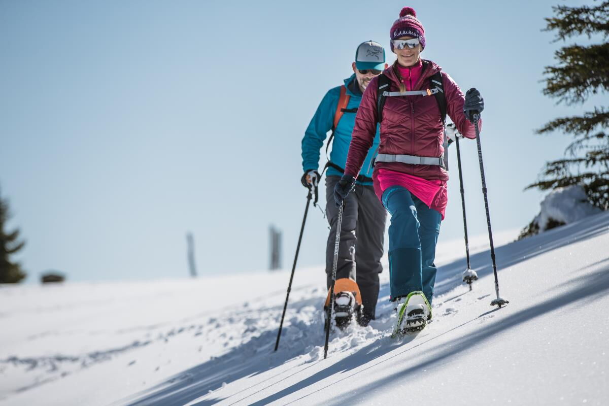Two ski tourers ascending the snow-covered slope near the Karwendel, ski touring from the Tiroler Hütte in Tyrol