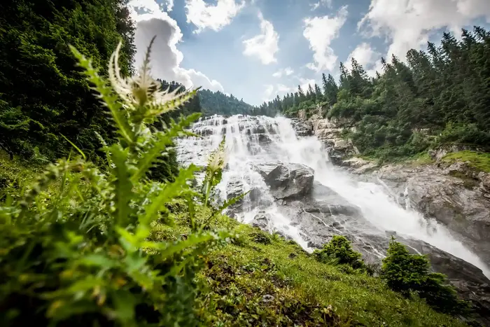 The Grawa waterfall spreading down the rock step in the upper Stubai Valley