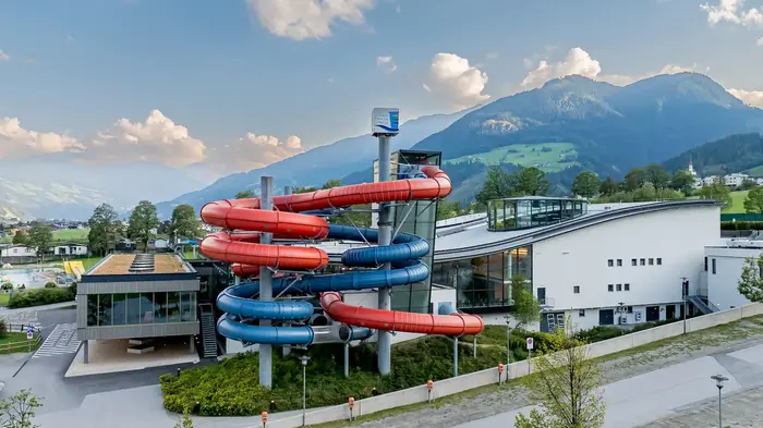 Erlebnistherme Zillertal in Fügen with red-and-blue slides and outdoor pool