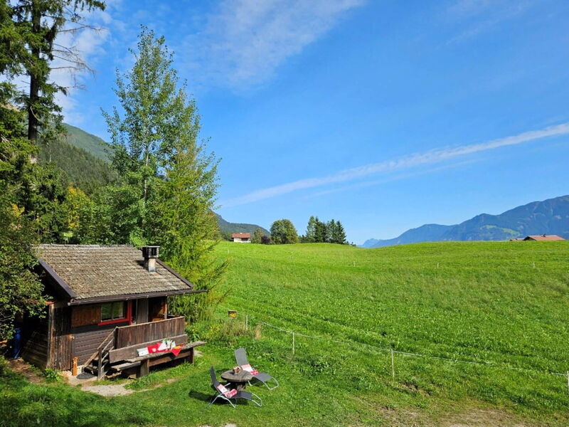 Wooden hut at 887 m above Terfens, view across meadows to the Silberregion Karwendel