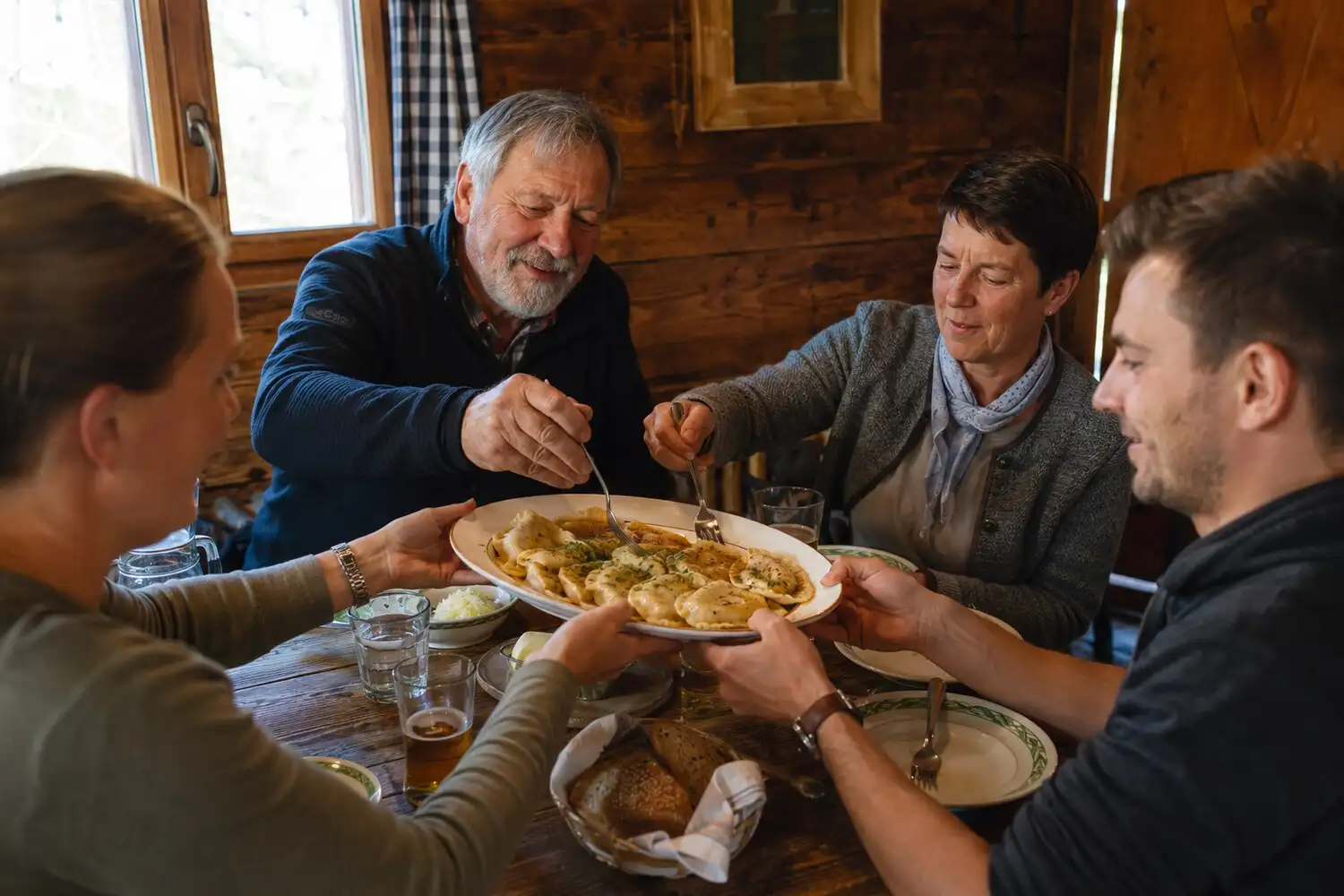 Kärntner Kasnudeln being prepared and enjoyed at the hut