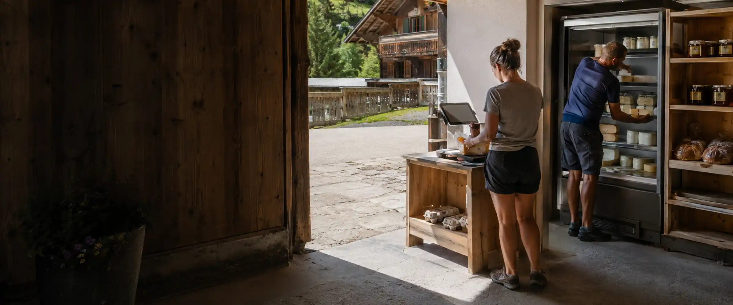 Self-service farm shop in the barn with fridge, pantry shelf and bread